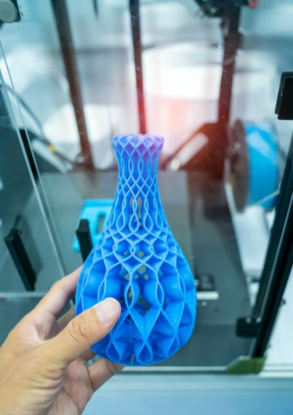 hand with Object printed on 3d printer close-up